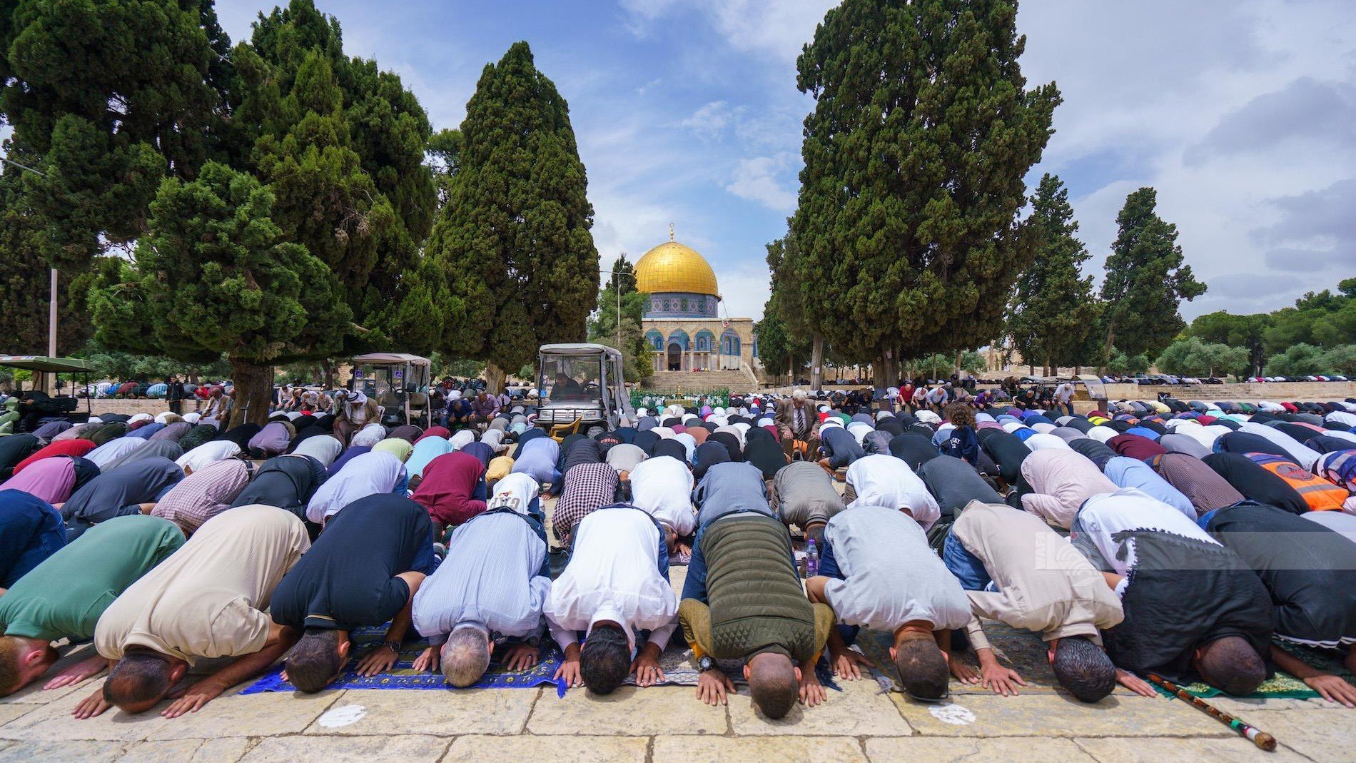 Palestinians pray outside the Al Aqsa mosque complex