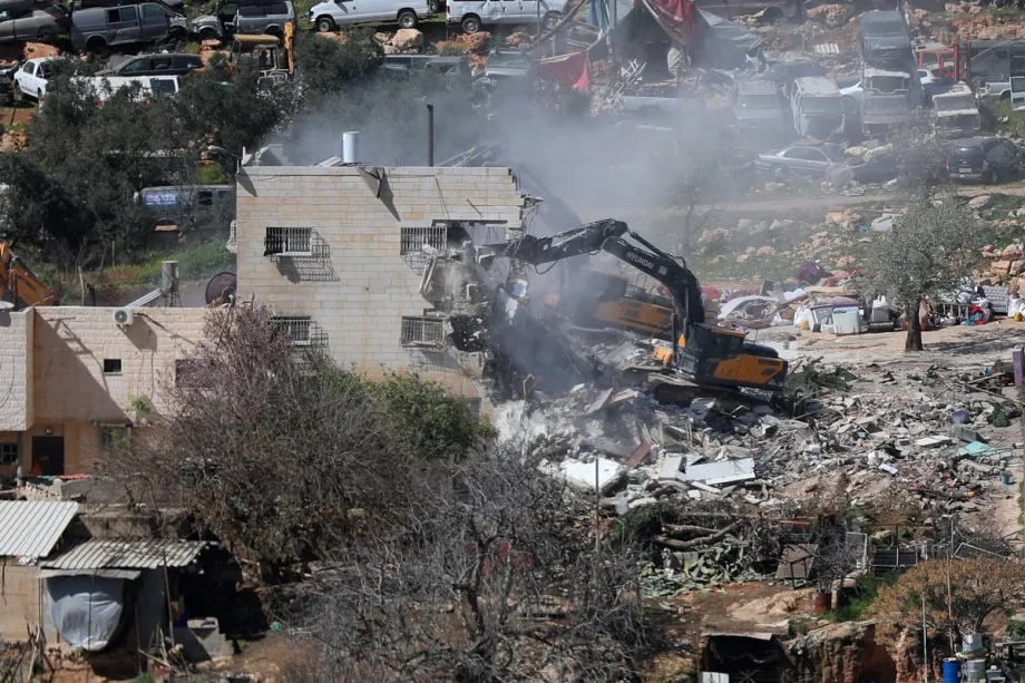 Israeli army demolishes a residential building belonging to Palestinians claiming it is “unlicensed” in Hebron, West Bank on February 18, 2026.