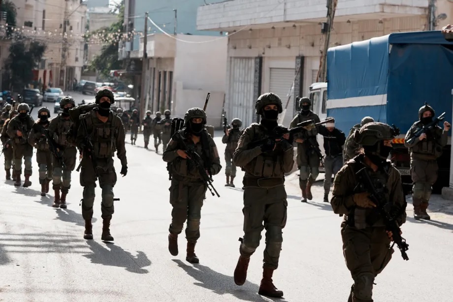 Israeli soldiers surround the Kefr Saba neighborhood after organizing a raid in Qalqilya, West Bank on December 4, 2025.