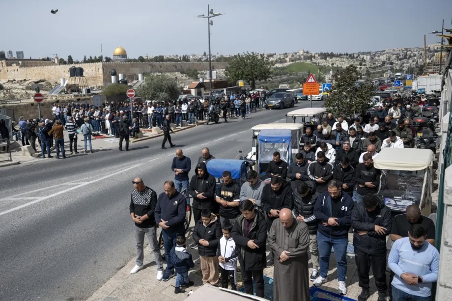 Palestinians perform the last Friday prayer of Ramadan in the streets after Israel closed Al-Aqsa Mosque to worship following Israeli attacks launched against Iran together with the United States on March 13, 2026 in Jerusalem.