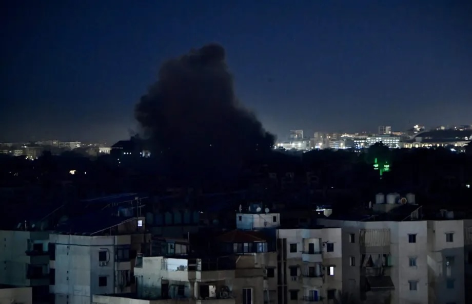 Smoke rises over the Dahieh area following Israeli airstrikes, with plumes visible across the city as residents react to the aftermath of the strikes in southern Beirut, Lebanon, on March 23, 2026.