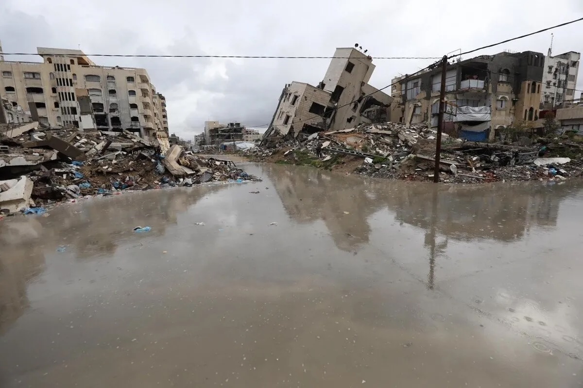 Palestinians battle with cold and rainy weather in Gaza on March 26, 2026.