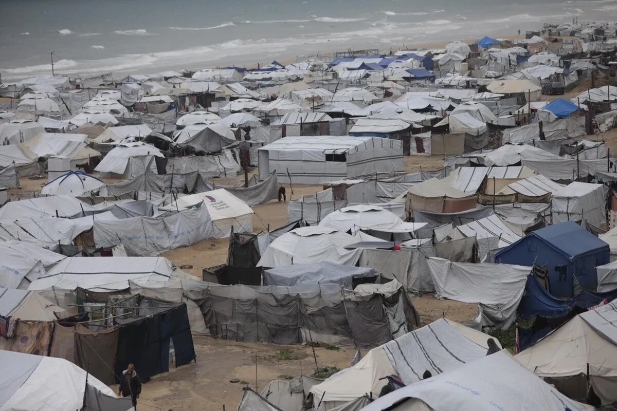Palestinians battle with cold and rainy weather in Gaza on March 26, 2026.