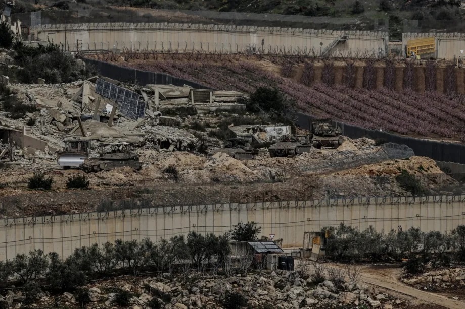 Israeli military vehicles and tanks are stationed in southern Lebanon, as seen from a vantage point in northern Israel on March 14, 2026.