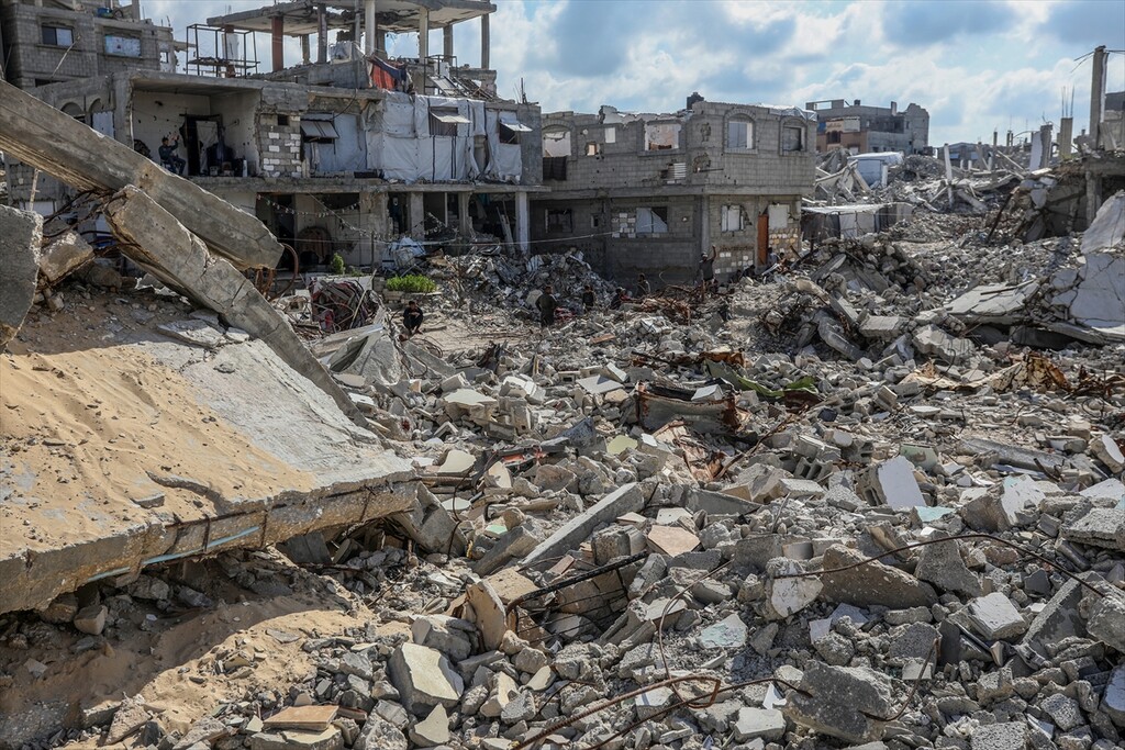 Palestinians try to sustain their daily lives among the ruins of homes destroyed by Israeli army attacks in Khan Yunis, southern Gaza Strip, Palestine, on April 13, 2026.