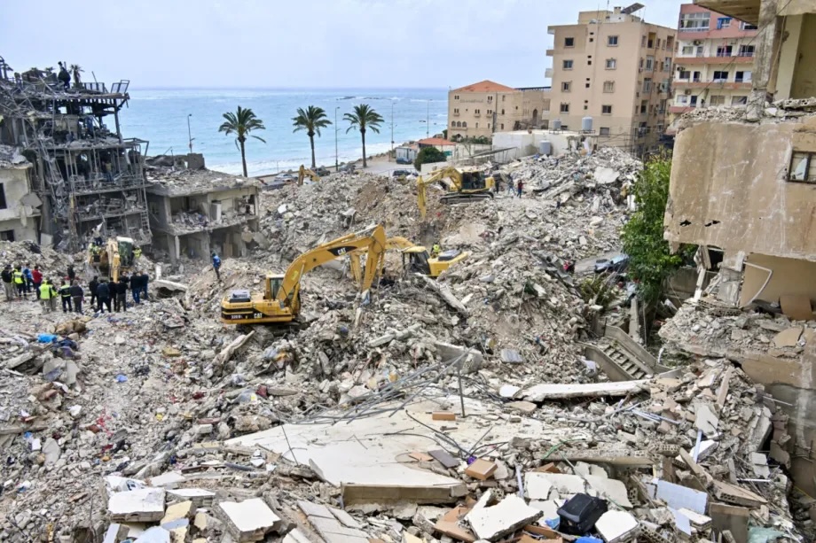 Civil defense and search and rescue teams are using heavy machinery to reach the bodies of civilians trapped under the rubble of buildings destroyed in the Israeli attacks following a temporary ceasefire between Lebanon and Israel in Tyre, Lebanon on April 19, 2026.