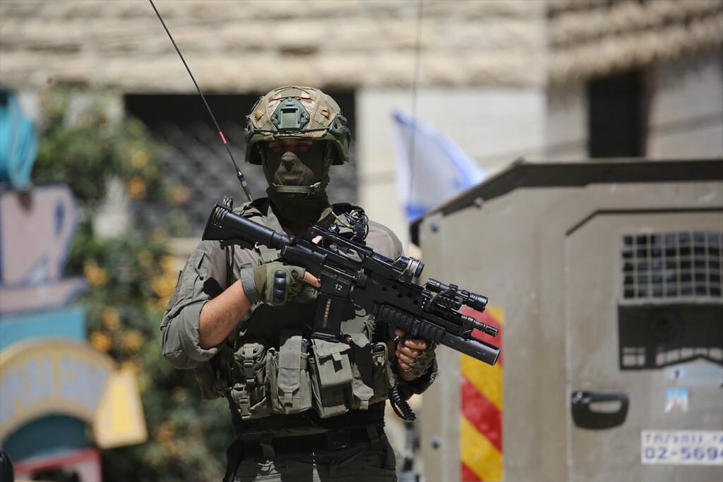 Israeli forces carrying weapons, raid Nablus city of West Bank, Palestine on April 23, 2026.