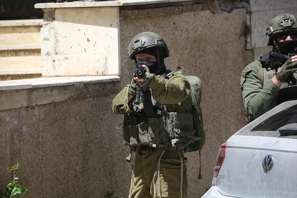 Israeli forces carrying weapons, raid Nablus city of West Bank, Palestine on April 23, 2026.