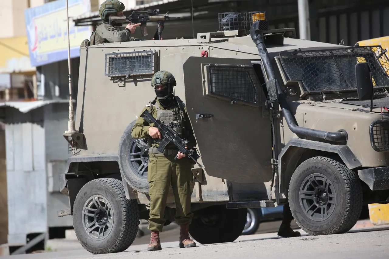 Heavily armed Israeli soldiers conduct a military operation in the West Bank. Such operations have increased significantly in frequency and intensity since October 2023. These operations often involve searches, arrests, and confrontations with local residents, who are generally unarmed.