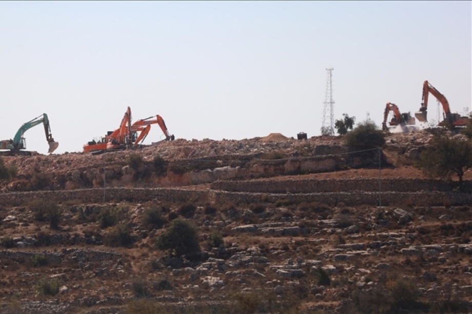 Israeli heavy duty machines carry out excavation work, damaging Palestinian-owned lands to build an illegal Jewish settlement in the Jabal Juheihan area of Hebron, West Bank on October 27, 2025.