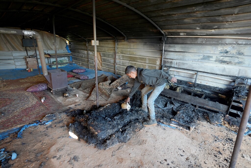 Palestinians examine the damage to their vehicles following an attack by Israelis in the village of Luban ash-Sharqiya, near Nablus, Palestine, on April 6, 2026.