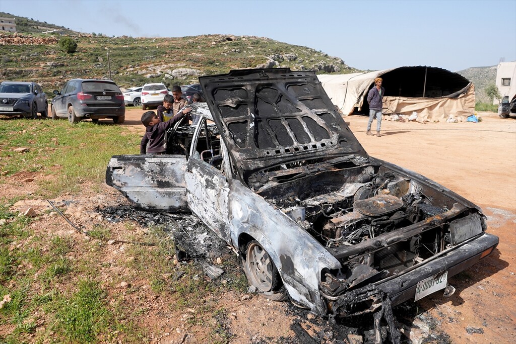 Palestinians examine the damage to their vehicles following an attack by Israelis in the village of Luban ash-Sharqiya, near Nablus, Palestine, on April 6, 2026.