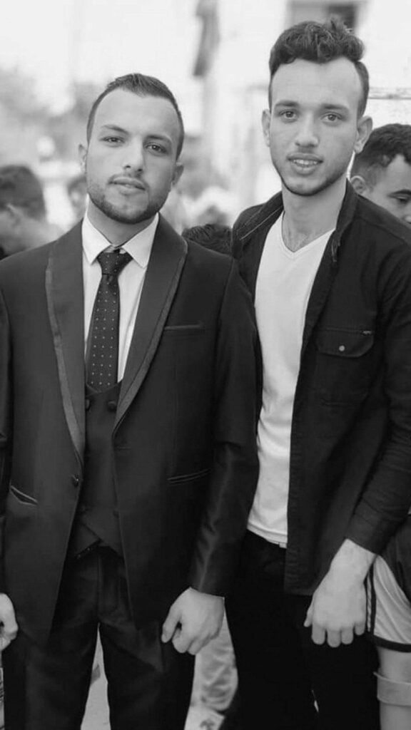 Two well dressed Palestinian young men.