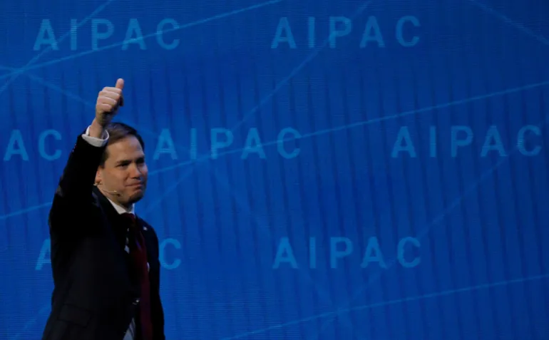 Secretary of State Marco Rubio holding a thumb up at an AIPAC conference.
