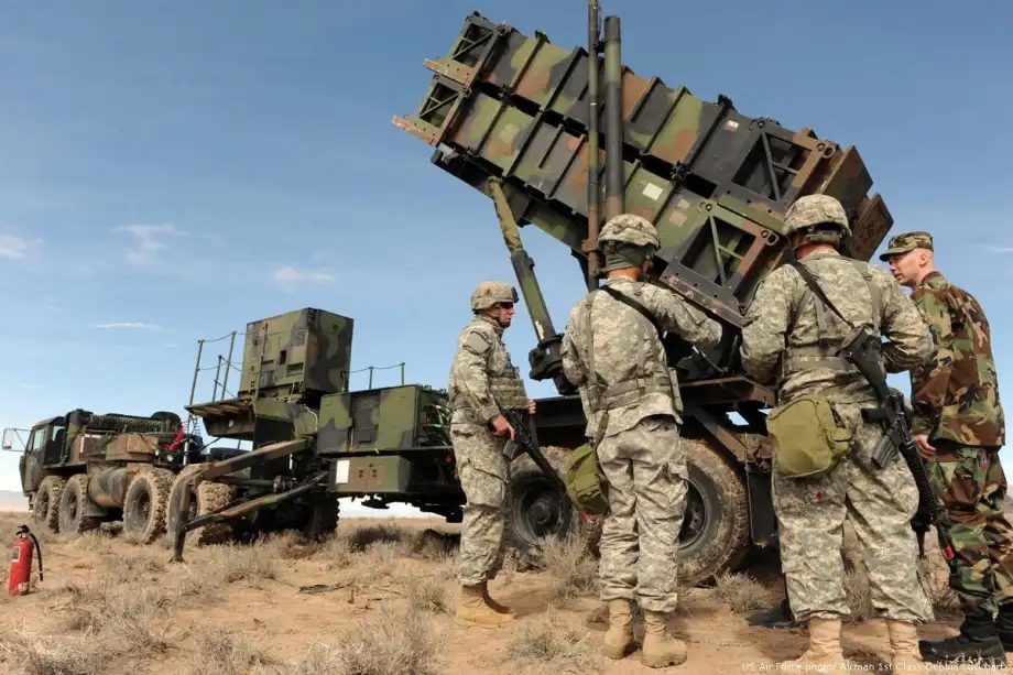 US soldiers can be seen with patriot missiles