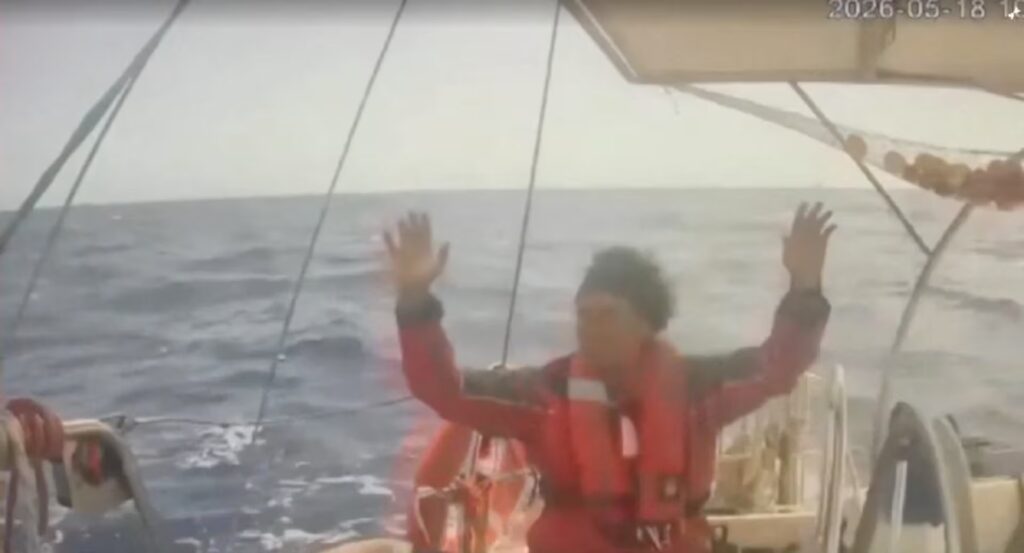 A person raises his hands