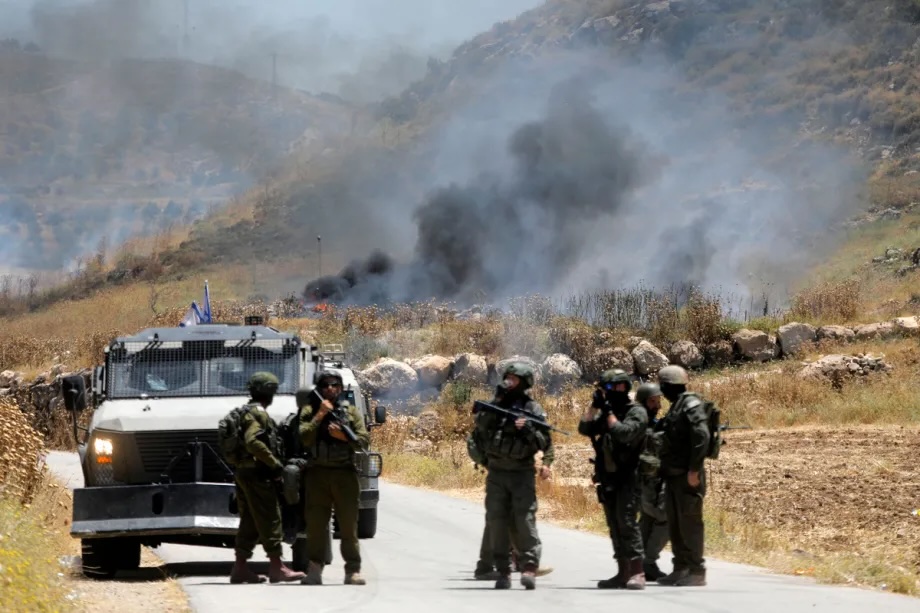 Israeli forces and settlers block access roads with earth barriers and stones in the Jallat area east of Idhna, preventing Palestinian residents from reaching nearby land in Hebron, West Bank, Palestine on June 5, 2026.