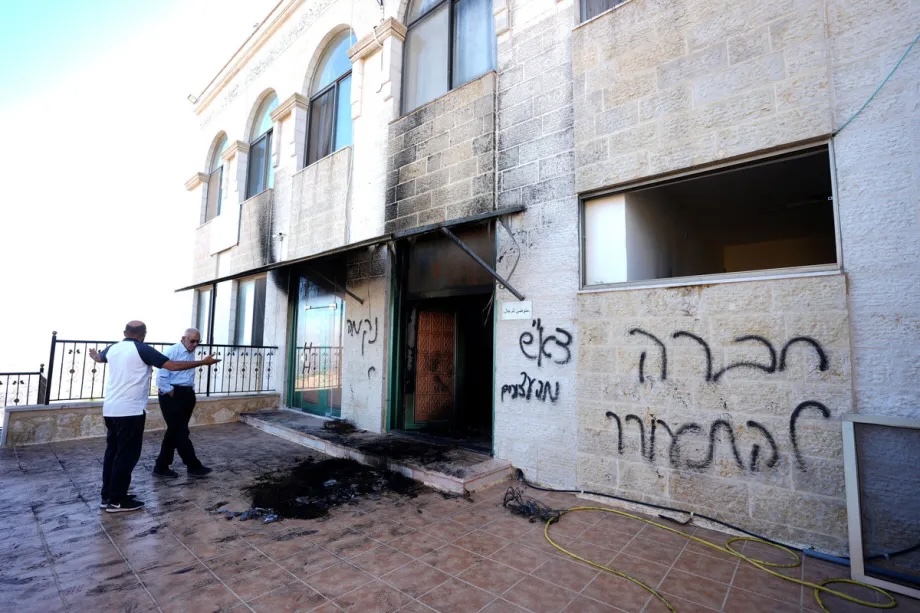 Palestinian residents inspect damage at a mosque in the village of Jiljilya after Israeli settlers set fire to the building, damaging the women’s prayer section and writing Hebrew graffiti on its walls in Ramallah, West Bank, Palestine on June 17, 2026.