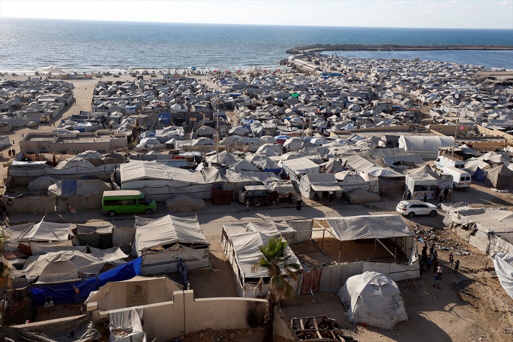 Displaced Palestinian families try to sustain their lives with severely limited resources inside an overcrowded makeshift tent camp set up along the Mediterranean coastline of Gaza City, Gaza, Palestine on June 22, 2026.