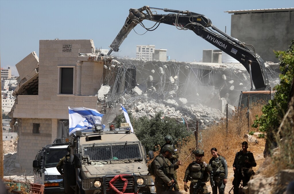Israeli forces demolish a house belonging to Palestinians in the town of Qalqas, near the city of Hebron in the southern West Bank, citing lack of a building permit, on June 23, 2026.