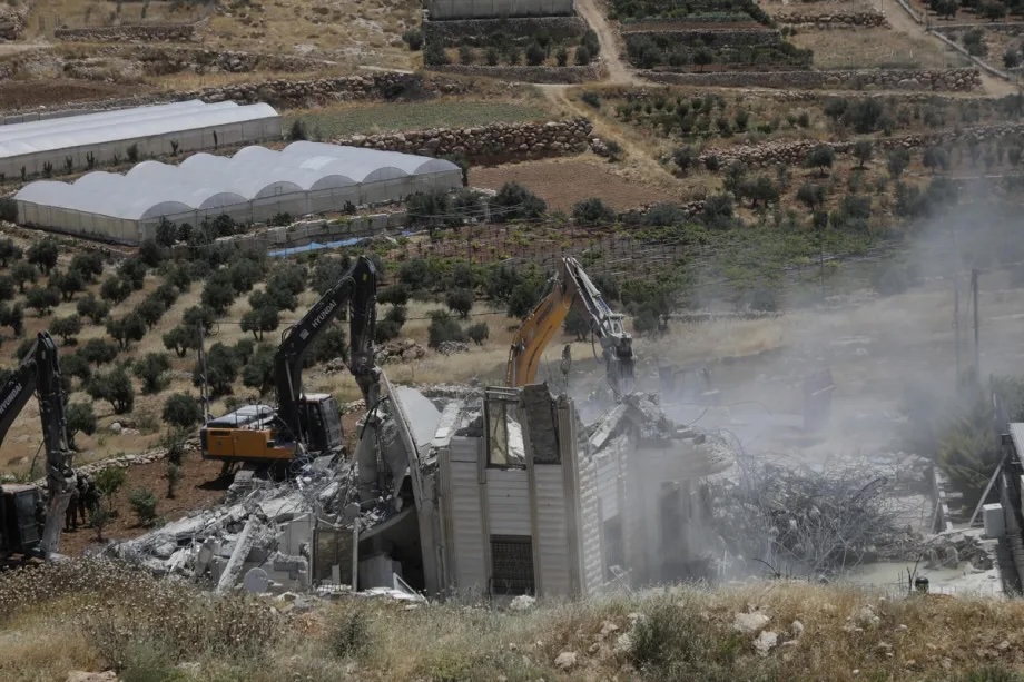 Israeli army heavy machinery demolishes a 2-story Palestinian house, built on a 500-square-meter area and belonging to Nayif Abu Sneineh, in Qalqas village, south of the West Bank city of Hebron, Palestine on June 08, 2026.
