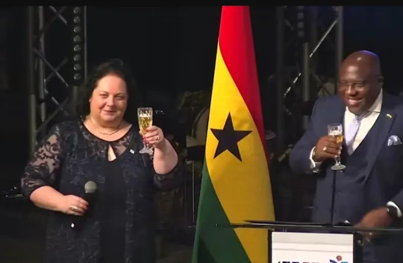 Israeli Ambassador to Ghana Shlomit Sufa speaks at an event in Ghana. She toasts with a champaign glass.
