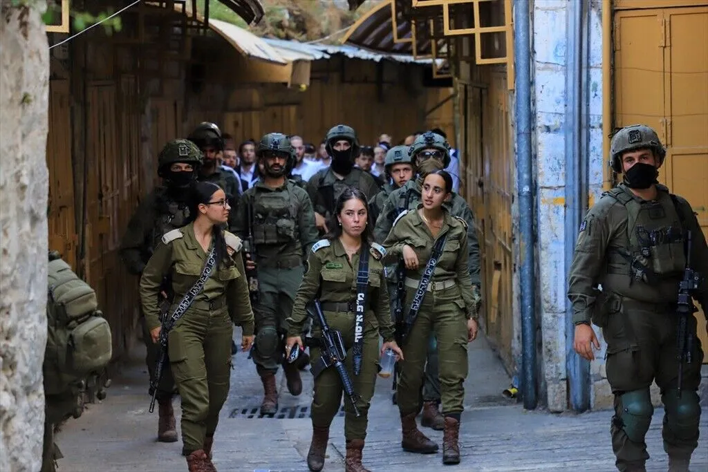 Israeli forces block entry and exit points with iron barricades to restrict the movement of Palestinians as illegal Israeli settlers, escorted by Israeli forces, raid the Old City area of Hebron in the southern West Bank, Palestine on July 11, 2026.