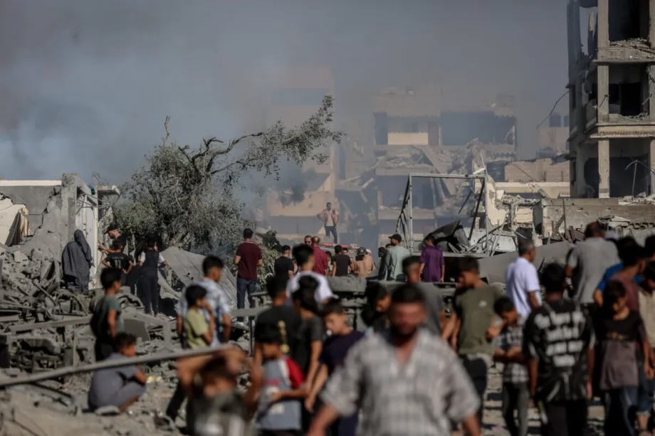 Smoke rises amid rubble and destruction on Al-Sinaa (Industrial) Street in western Gaza City on July 12, 2026, after the Israeli military targeted several buildings using unmanned aerial vehicles (UAVs).