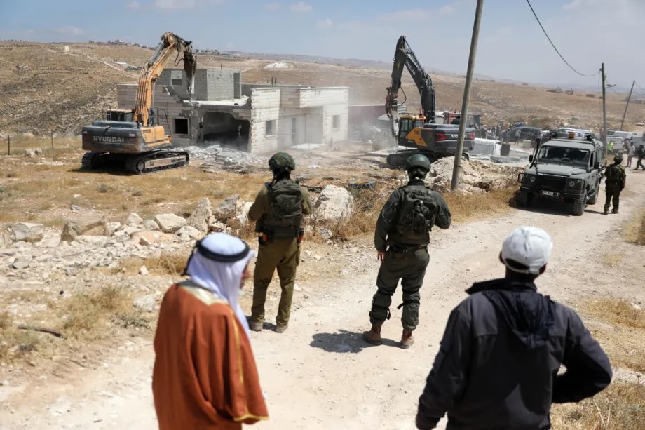 Israeli forces stand by in the area as the Israeli military demolish two Palestinian homes on the grounds that they had been built without permits in Masafer Yatta, south of Hebron, West Bank, Palestine on July 07, 2026.