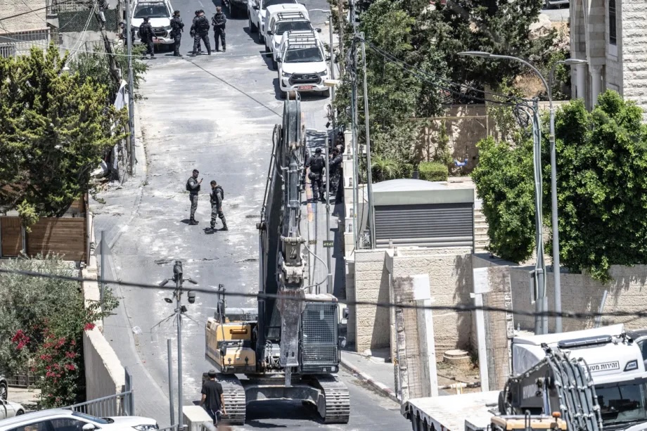Israeli police accompany municipal teams as the Israeli Municipality of Jerusalem demolishes a four-apartment building belonging to Palestinian Fuad Awadallah, claiming it had been built without a permit, in the town of Sur Baher in East Jerusalem, on July 8, 2026.