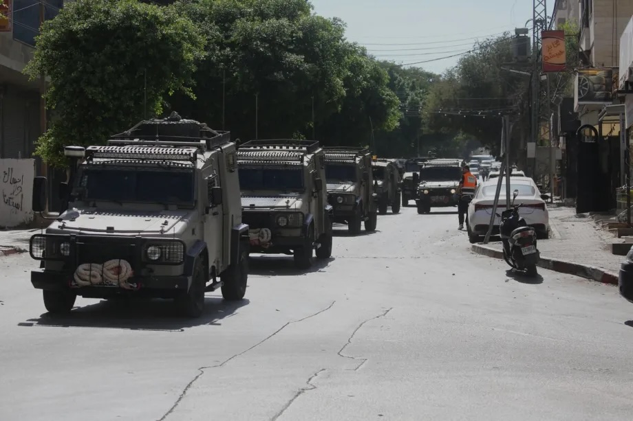 Israeli soldiers block the road leading to Nablus Hospital, after raiding the hospital and detaining a wounded Palestinian, and his sibling in Nablus, West Bank, Palestine on July 24,