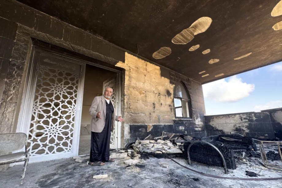 Fire damage is seen at the entrance of Al-Rahmah Mosque following an arson attack by Israeli settlers in the village of Kusra, south of Nablus in West Bank, Palestine on July 26, 2026.