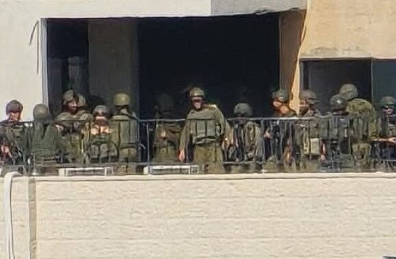 Israeli forces operate from the roof of a building in the Sateh Marhaba neighborhood of Al-Bireh in the West Bank, Monday, July 6, 2026.
