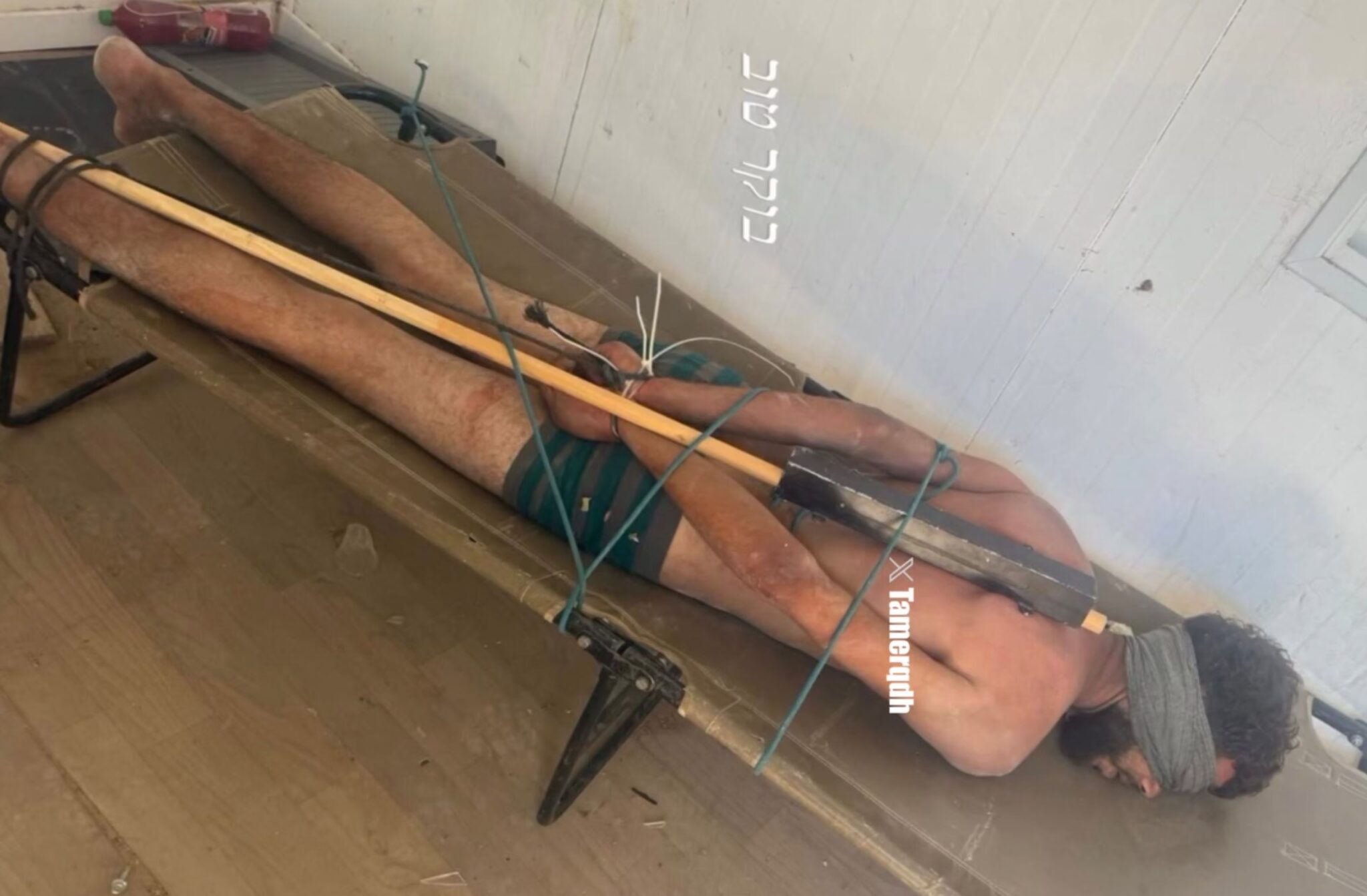 The Israeli military has confirmed the authenticity of the photo, taken by an Israeli soldier, showing a Palestinian detainee bound to an iron rod.