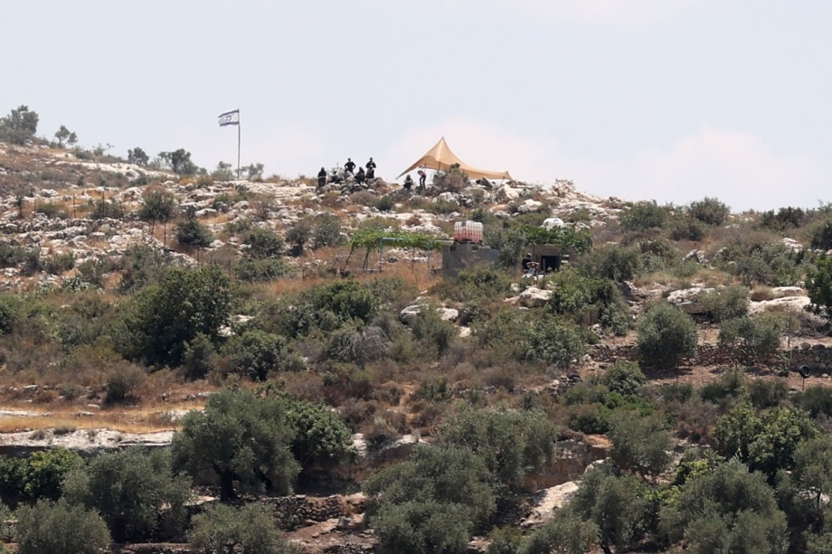 Israelis gather at a new illegal settlement near the village of Deir Abu Mashal, west of Ramallah, West Bank, Palestine on June 19, 2026.