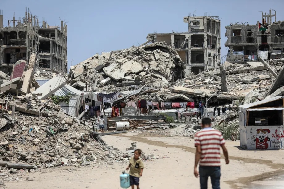 A Palestinian family lives amidst the rubble of destroyed buildings in Beit Lahia, northern Gaza Strip, Palestine on August 03, 2026.