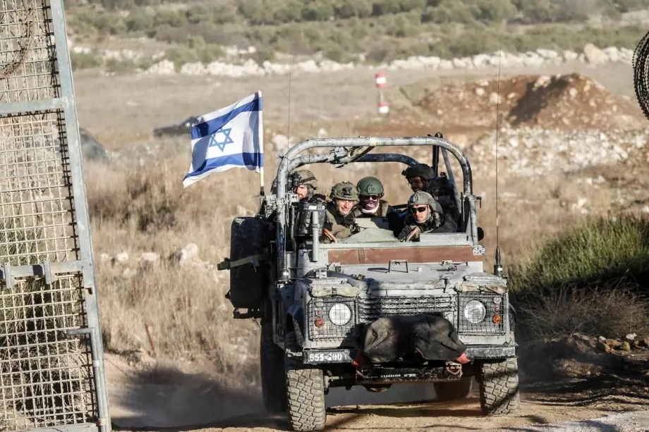 A view of military vehicles patrolling the Syrian-Israeli border in the Majdal Shams area of the Golan Heights, December 15, 2024. 