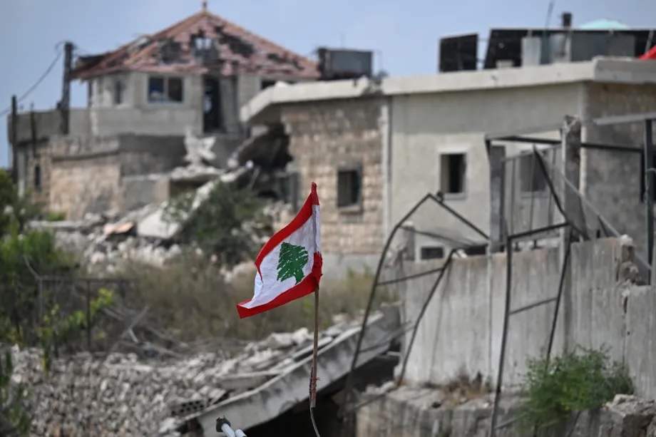 A view of a Lebanese flag near debris of a building in the southern town of Western Zawtar, Lebanon, August 08, 2026.