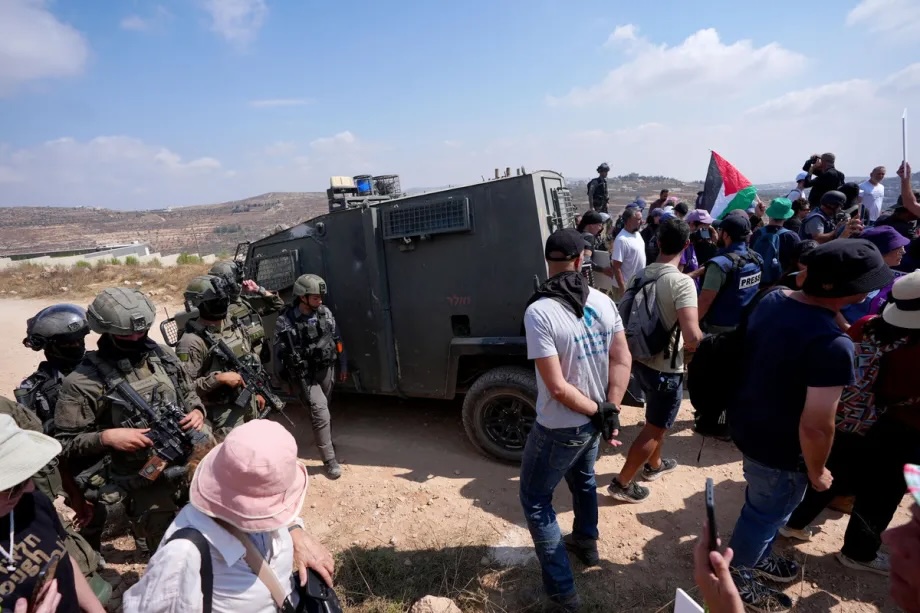 Activists attempt to deliver basic supplies to three Palestinian families living in Qusra, West Bank, Palestine, on August 14, 2026. Israelis, in the presence of IDF soldiers, have blocked roads leading to the families’ homes since August 9, restricting access to and from the area.