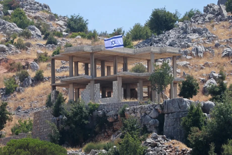 An Israeli flag placed by the Israeli troops on a building under construction is seen while Israel continues to commit ceasefire violations in the village of Kafr Shuba (Kfar Chouba) in the Nabatieh Governorate of southern Lebanon on August 29, 2026.