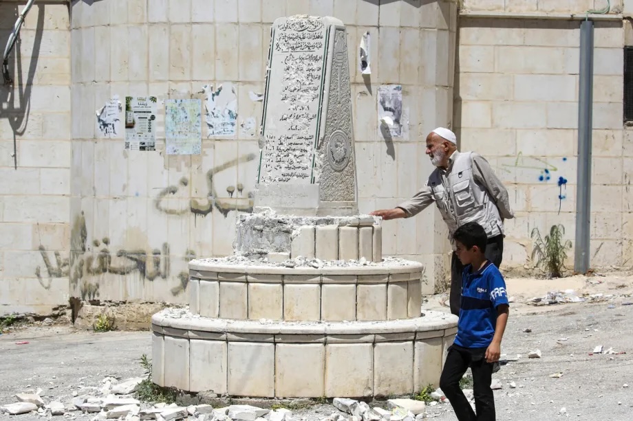 Palestinians inspect the damage to a Palestinian memorial, which was smashed with a sledgehammer by far-right Israeli lawmaker Zvi Sukkot and those accompanying him, who entered the village of Madama near Nablus in the northern West Bank under the protection of Israeli soldiers, on August 25, 2026.