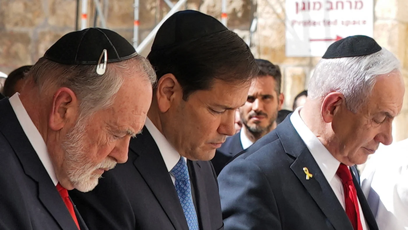US ambassador to Israel Mike Huckabee, left, joins Secretary of State Marco Rubio and Israeli Prime Minister Benjamin Netanyahu on a visit to the Western Wall, one of Judaism's holiest sites, in the Old City of Jerusalem, on 14 September 2025 (Nathan Howard/Pool/AFP)