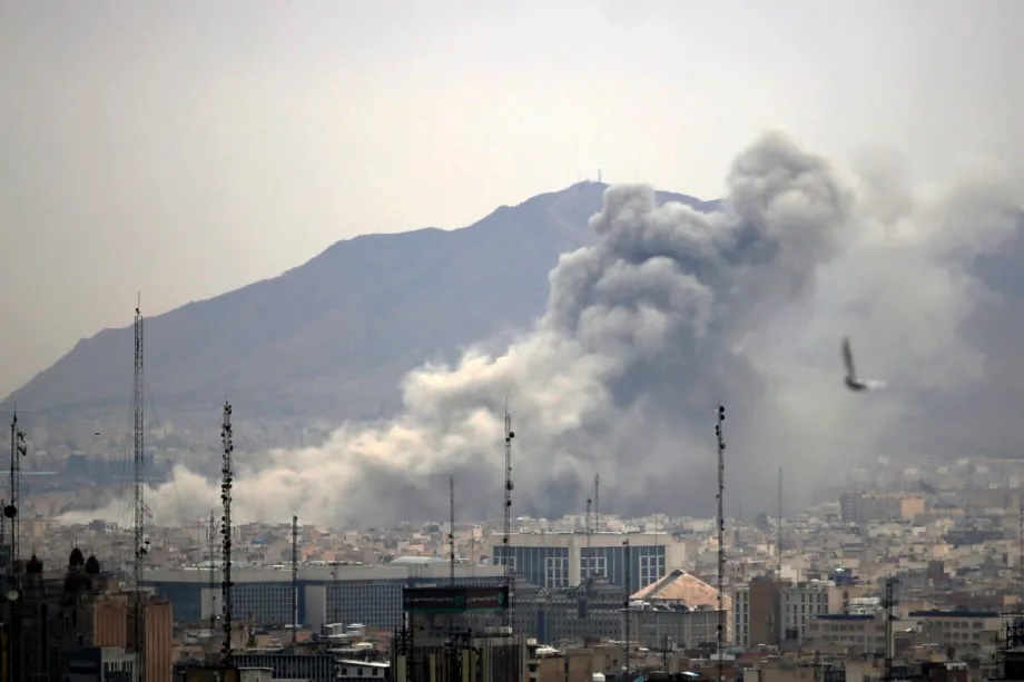 Smoke rises after airstrikes in Tehran, Iran on March 13, 2026.