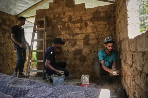 Photos: Palestinians rebuild Gaza’s ruins with mud bricks, scrap Photos: Palestinians rebuild Gaza’s ruins with mud bricks, scrap